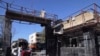 The gate of a police headquarters is seen after a suicide car bombing in the southeastern Iranian port city of Chabahar, December 6, 2018