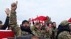 Turkey-backed Free Syrian Army fighters shout slogans before heading towards the Syrian border, in Kirikhan, Turkey, Sunday, Jan. 21, 2018.