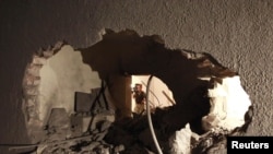 Damage that the LIbyan government said was caused by a NATO-led air strike to the house of Saif al-Arab Qaddafi, son Muammar Qaddafi, in Tripoli