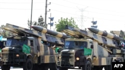 Iranian military trucks carry surface-to-air missiles during a parade on the occasion of the country's Army Day, in Tehran, April 18, 2017