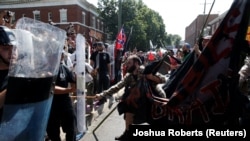 White supremacist demonstrators and counterprotesters clash in Charlottesville, Virginia, on August 12. 