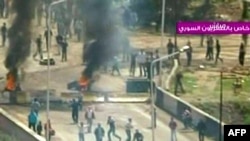 A video TV grab shows clashes in the flashpoint town of Daraa on April 8.