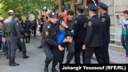 Azerbaijani police arrest protesters following the jailing of youth activists in Baku on May 6.