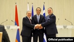 Cyprus -- Foreign Ministers Nikos Christodoulides (C) of Cyprus, George Katrougalos of Greece (R) and Zohrab Mnatsakanian of Armenia shake hands after talks held in Nicosia, June 4, 2019.