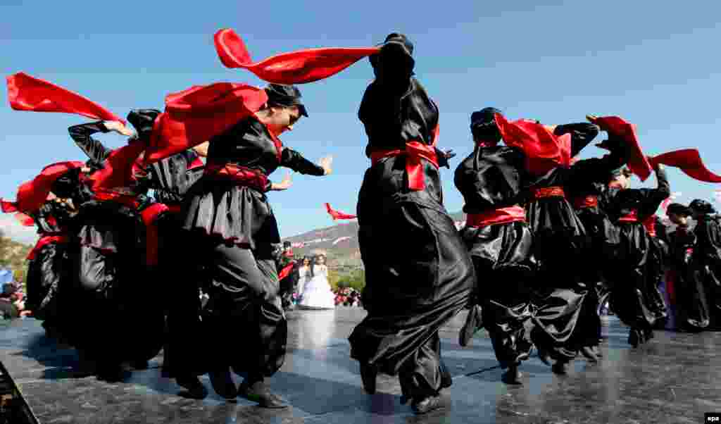 Young musicians dressed in traditional costumes dance during a religious holiday in Mtskheta, Georgia. (epa/Zurab Kurtsikidze)