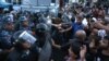 Armenia - Protesters scuffle with riot police near a police station seized by opposition gunmen, Yerevan, 19Jul2016.