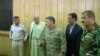 FILE: Police Chief of Kandahar General Abdul Raziq (L), Governor of Kandahar Zalmay Wesa (2nd L) and Commander of NATO forces in Afghanistan U.S. General Scott Miller (C) during the October 18 meeting.