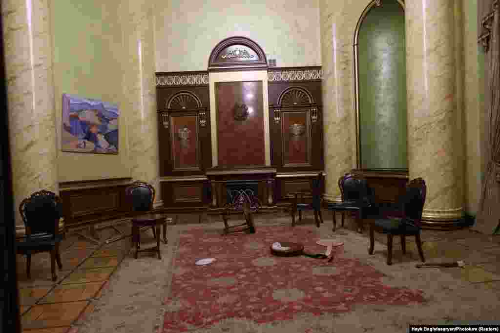 Damage left over inside offices in government headquarters in Yerevan after protesters had rioted. At around 8 a.m. on November 10, Pashinan wrote on Facebook: &quot;Of course, I am in Armenia and I continue to do my job&quot; as Armenian prime minister.