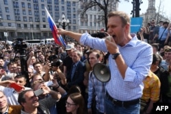 Russian opposition leader Aleksei Navalny addresses supporters during the unauthorized anti-Putin rally on May 5. He was detained by police shortly afterwards.