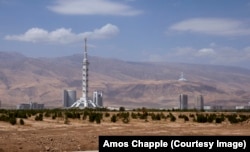 The Monument to the Constitution (left) and the Turkmenistan Tower (top right). The 185-meter monument is the tallest structure in Turkmenistan.