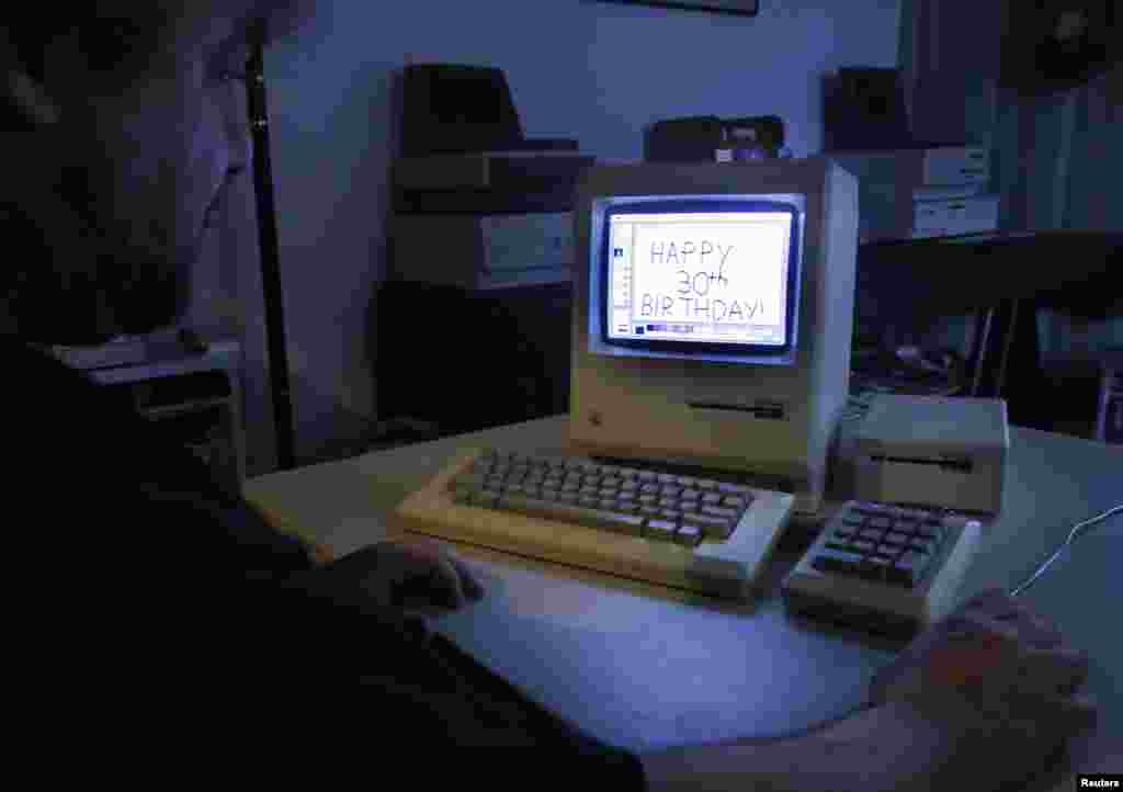 Curator Adam Rosen writes &quot;Happy 30th Birthday&quot; using version 1 of MacPaint on an original 128K Macintosh computer at the Vintage Mac Museum in Malden, Massachusetts on January 18, 2014.