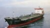 JAPAN -- A picture of the Kokuka Courageous, one of two that were hit in suspected attacks in the Gulf of Oman, is displayed during a news conference by the ship owner Kokuka Sangyo Ltd. at the company office in Tokyo, June 13, 2019