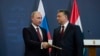 Премьер-министр Венгрии Виктор Орбан (справа) с президентом России Владимиром Путиным после завершения их совместной пресс-конференции в здании парламента в Будапеште, 17 февраля 2015 года