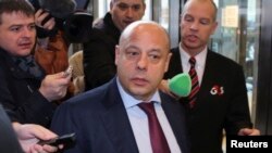 Ukrainian Energy Minister Yuriy Prodan (center) arrives for gas talks between the European Union, Russia and Ukraine at the EU Commission headquarters in Brussels on October 29.