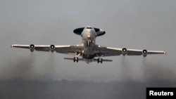 A NATO AWACS (Airborne Warning and Control Systems) aircraft takes off on a flight to Poland from an air base in Geilenkirchen near the German-Dutch border.
