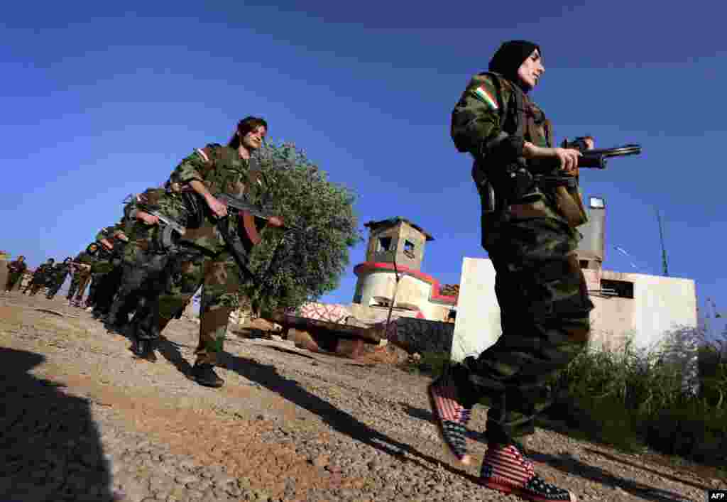 Iranian Kurdish female members of the Freedom Party of Kurdistan take part in a training session in Dibis, some 50 kilometers northwest of Kirkuk, Iraq. (AFP/Safin Hamed)