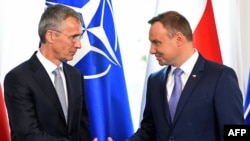 NATO Secretary-General Jens Stoltenberg (left) and Polish President Andrzej Dudameet hold a press conference in the Belweder Palace in Warsaw on July 7.