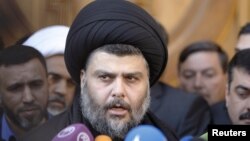 Iraqi Shi'ite cleric Muqtada al-Sadr speaks to the media during a visit to the Our Lady of Salvation Church in Baghdad on January 4.
