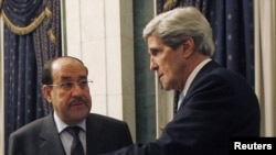 John Kerry në takim me kryeministrin e Irakut Nuri al-Maliki (majtas) 