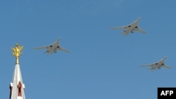 Russian Tu-22 M3 bombers fly over Red Square during a Victory Day parade in Moscow.