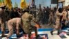 Iraqi Popular Mobilization Forces burn representations of U.S. and Israeli flags during "al-Quds" Day, Arabic for Jerusalem, in Baghdad, Iraq, Friday, May 31, 2019. Jerusalem Day began after the 1979 Islamic Revolution in Iran, when the Ayatollah Khomeini