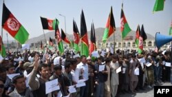 Afghan protesters shout slogans during a demonstration against Taliban militants and the kidnapping of civilians in a northern province, near the Eid Gah Mosque in Kabul, on June 2.