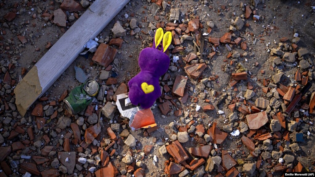 UKRAINE – A toy sits among the debris near an apartment building damaged following a rocket attack, in Kyiv, February 26, 2022