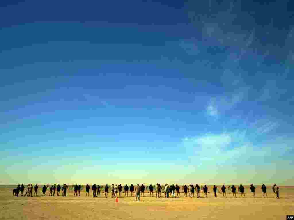 Afghan National Police officers stand in line as they attend a shooting course at Camp Leatherneck on the outskirts of Lashkar Gah in Helmand Province on February 17. Photo by Adek Berry for AFP