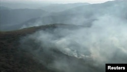 A video grab shows smoke billowing from the area on November 30 after the deadly NATO attack in the Pakistan-Afghanistan border area.