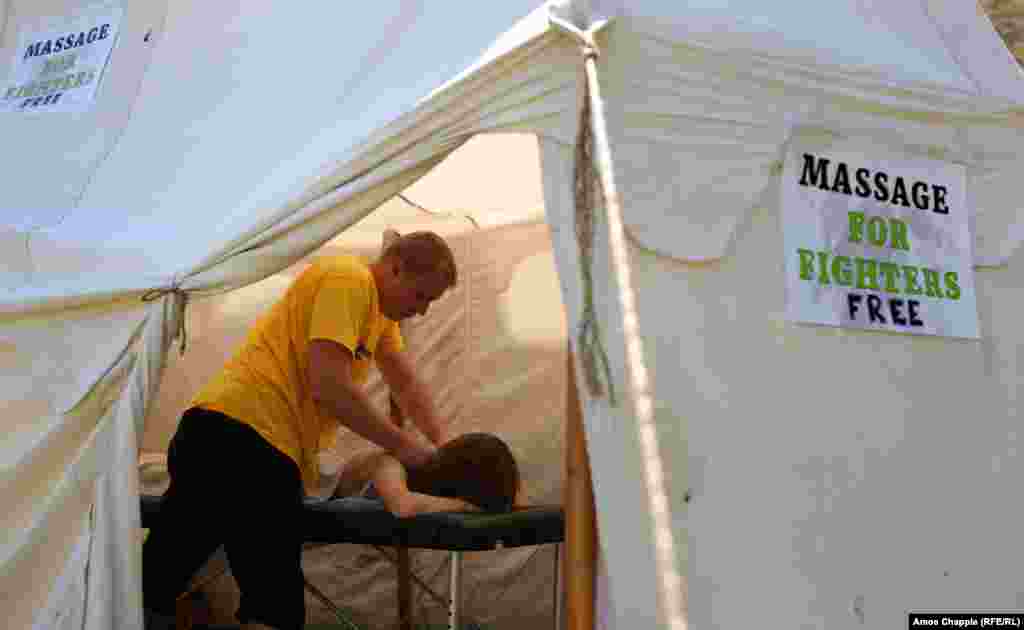A participant takes advantage of the massage tent. 