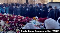 Metropolitan Grigory of Chelyabinsk and Miass (fourth from right) attends a memorial religious service for the Magnitogorsk gas-explosion victims on January 8. 