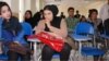 Lina and Lida listening intently during a recent journalism class.