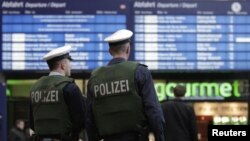 Police patrol the entrance area to the main railway station in Berlin on November 17.