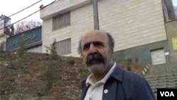 Journalist Keyvan Samimi stands in front of Evin prison