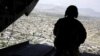 A U.S. soldier mans a weapon at the tailgate aboard the helicopter carrying U.S. Defense Secretary James Mattis as he arrives at Resolute Support headquarters in the Afghan capital Kabul on April 24.