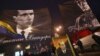 Ukraine -- People hold flags picturing Ukrainian politician Stepan Bandera (L), one of the leaders of Ukrainian national movement and leader of the Organisation of Ukrainian Nationalists (OUN) and his ally Roman Shukhevych (R) during a march in Kyiv, Janu