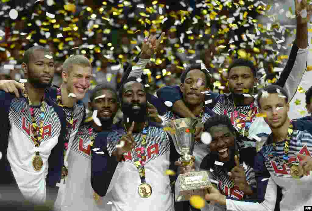 U.S. players celebrate after winning the final match of the 2014 FIBA world basketball championship versus Serbia at the Palacio de los Deportes in Madrid. (AFP/Gerard Julien)