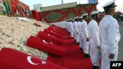 Hamas naval police hold a ceremony for the nine Turks who were shot dead during the Israeli raid on Gaza-bound aid ships in the Gaza City port following the May 2010 incident.