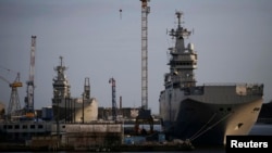 The Mistral-class helicopter carriers Sevastopol (right) and Vladivostok are seen at the STX Les Chantiers de l'Atlantique shipyard site in Saint-Nazaire, France, on May 21.