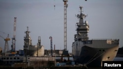 The Mistral-class helicopter carriers Sevastopol (right) and Vladivostok are seen at a shipyard in Saint-Nazaire in May.