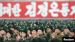 Soldiers attend a rally to celebrate the successful launch of the Unha-3 (Milky Way 3) rocket in December.