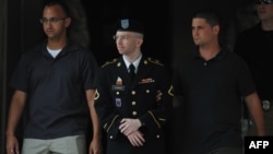 U.S. Army Private Bradley Manning (center) is escorted from a court-martial hearing in Fort Meade, Maryland earlier this week.