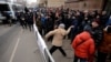 A Russian protester throws a stone towards the Turkish embassy in Moscow on November 25. The recent downing of a Russian warplane by a Turkish jet has caused widespread anger in the country.