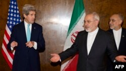 U.S. Secretary of State John Kerry (left) speaks with Iranian Foreign Minister Mohammad Javad Zarif as they prepare to take their seats for a new round of nuclear negotiations in Montreux, Switzerland, on March 2. 