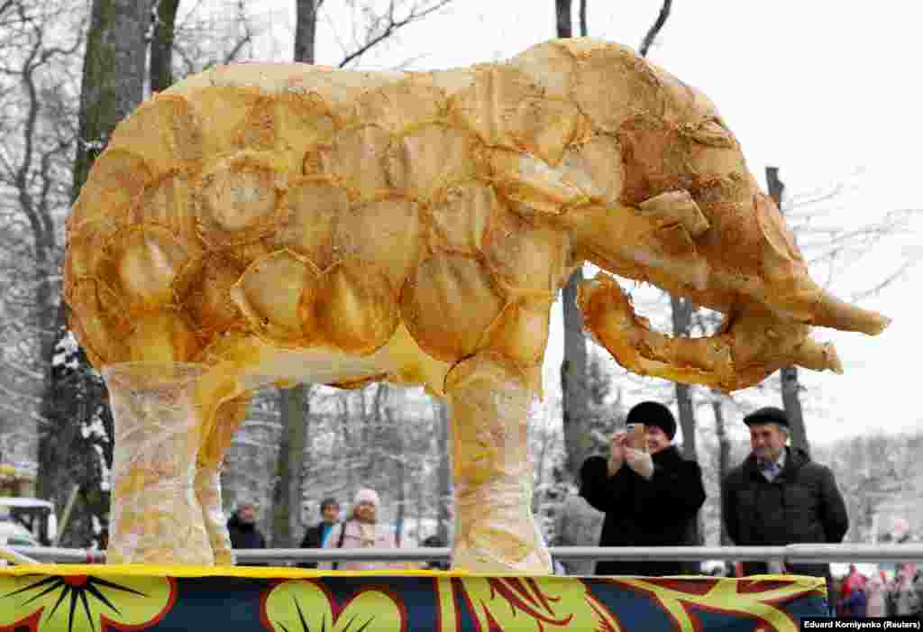 A figure of an elephant covered with pancakes is displayed during celebrations in Stavropol on March 1. Thin pancakes, or bliny, are a traditional food of the festivities and symbolize the sun.