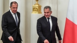 Foreign Minister Sergei Lavrov (left) and Defense Minister Sergei Shoigu will stay on.