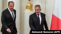 Foreign Minister Sergei Lavrov (left) and Defense Minister Sergei Shoigu will stay on.