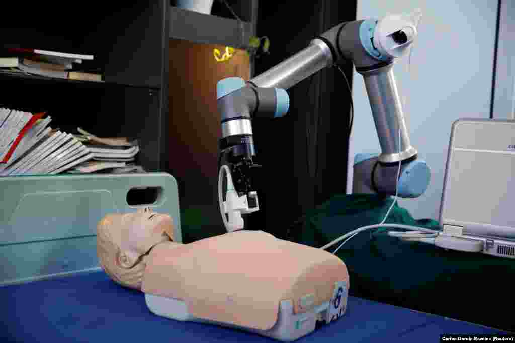 A robot designed to help medical workers treat coronavirus patients remotely is pictured during a demonstration for the media at the aerospace engineering school of Tsinghua University in Beijing, China, March 4, 2020.