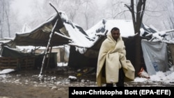 A migrant walks at the Vucjak refugee camp outside Bihac on December 3.