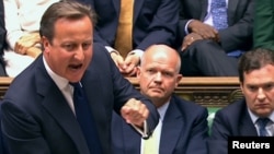Ұлыбритания премьер-министрі Дэвид Кэмерон Сирияға қарсы әскери операция бастау мәселесін қараған парламентте сөйлеп тұр. Лондон, 29 тамыз 2013 жыл.